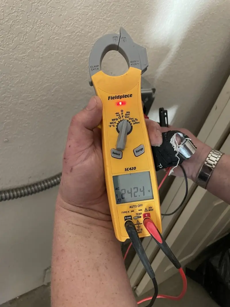 Voltage testing with clamp meter during Electrical Installation Services in Elkhart